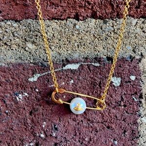 COPY - VIVIENNE WESTWOOD gold safety pin necklace.